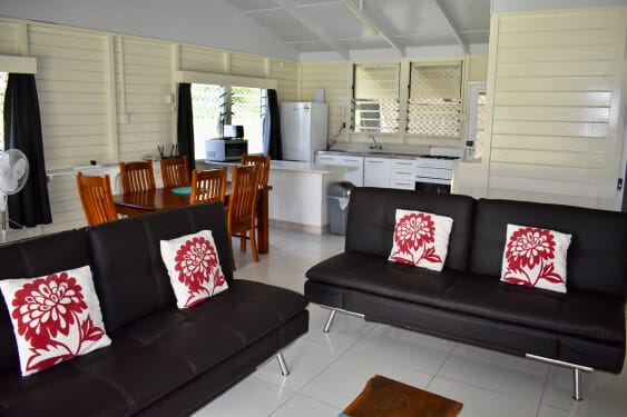 living area with lounge and dining room seating at Macs